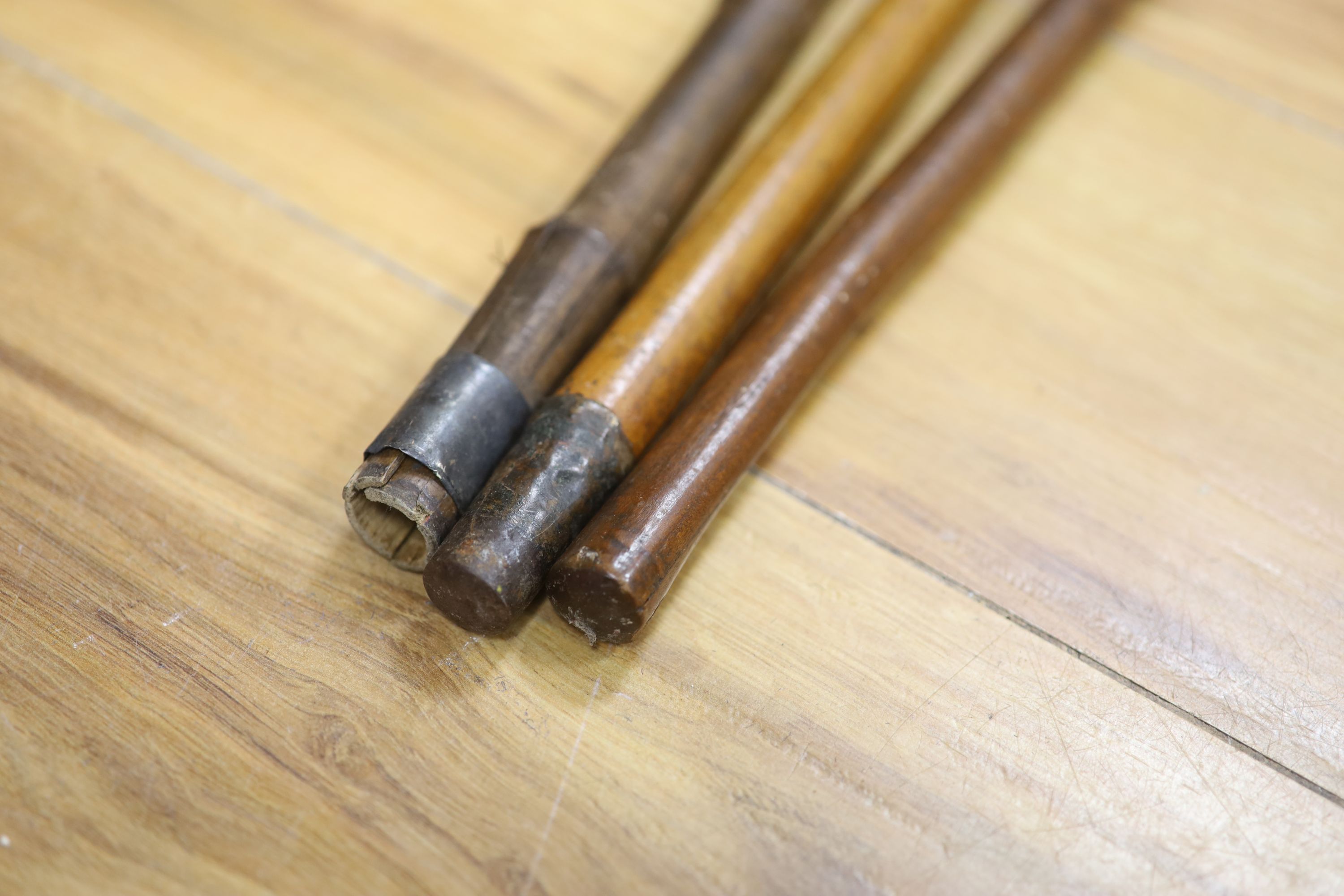 A sword stick, a knobkerrie and an agate mounted cane